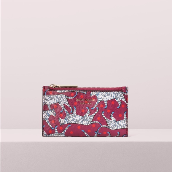 kate spade Handbags - Kate Spade sylvia panther small slim bifold wallet